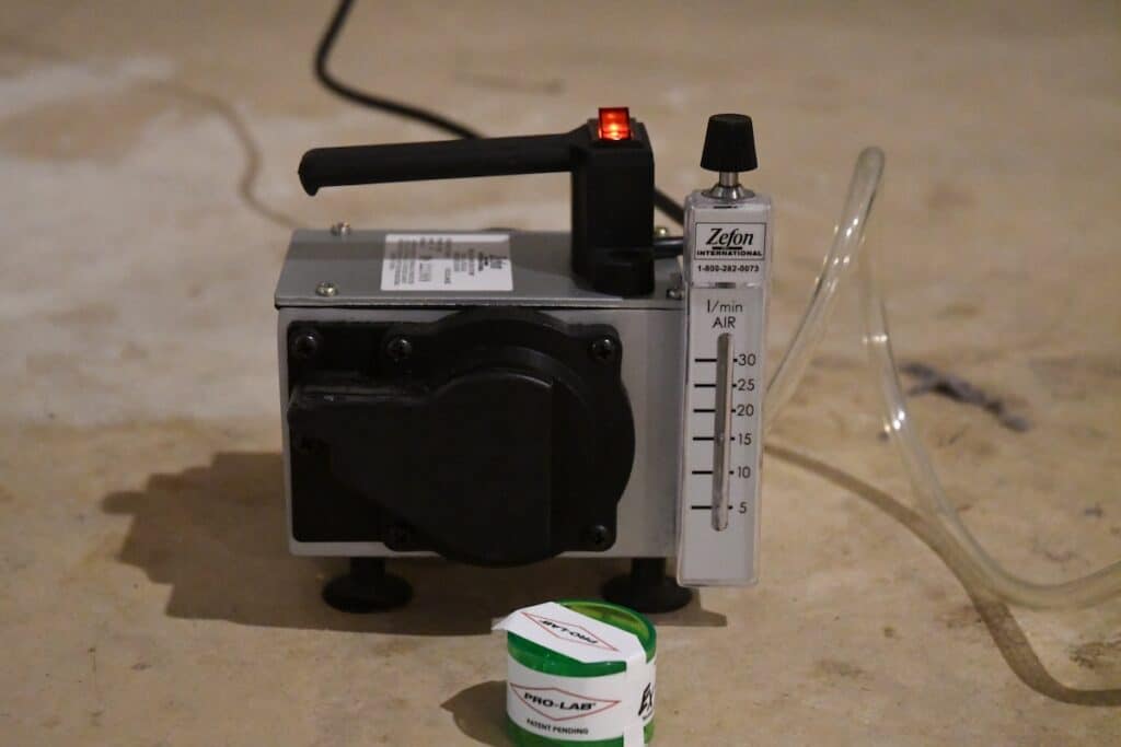 An indoor air quality/mold pump and the sample cell in front